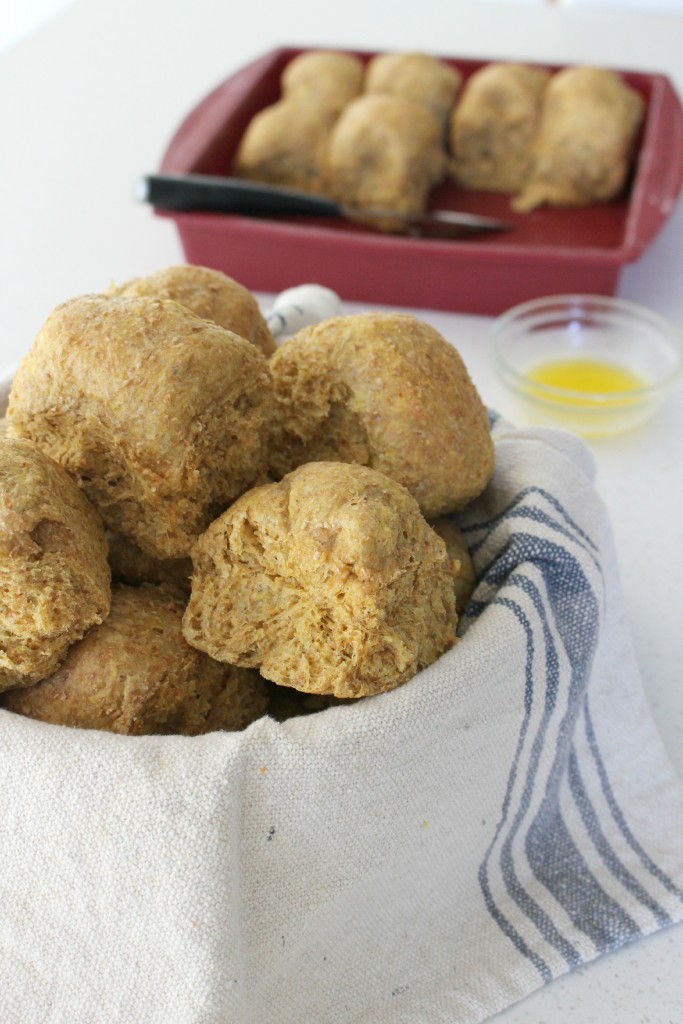 These whole wheat pumpkin dinner rolls are light, fluffy, perfectly moist, chewy, and fragrant with pumpkin spice. Add the honey butter and your family will love them!